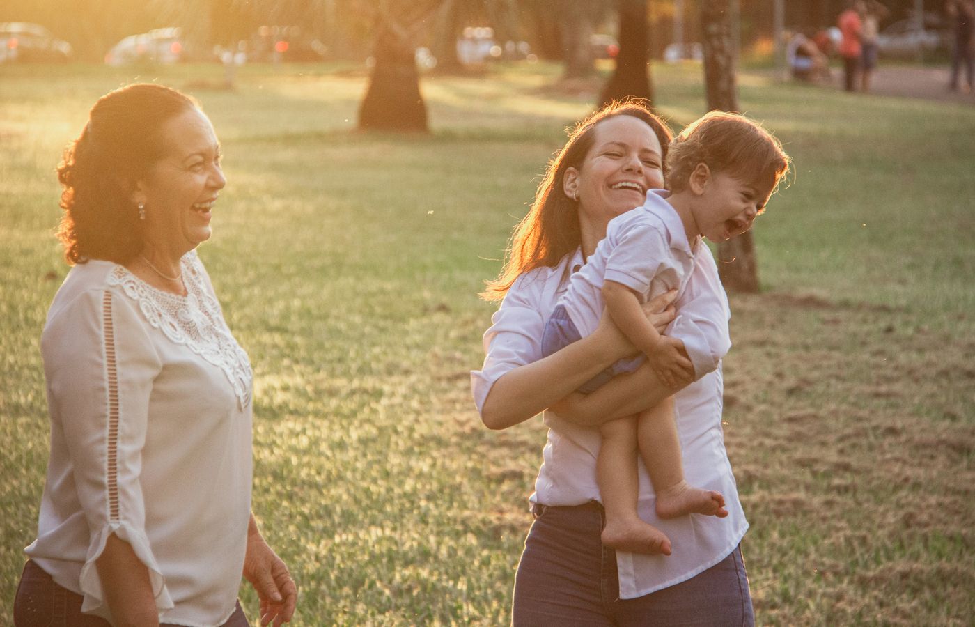 A family walking together outdoors at sunset